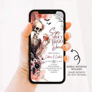 A hand holding a smartphone displaying an invitation for a costume and cocktail party.