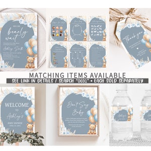 Pode incluir: Um conjunto de decora&ccedil;&otilde;es imprim&iacute;veis para um ch&aacute; de beb&ecirc; em um esquema de cores azul e bege com um urso de pel&uacute;cia e bal&otilde;es. O conjunto inclui uma placa de boas-vindas, uma placa de "n&atilde;o diga beb&ecirc;", etiquetas para garrafas de &aacute;gua e uma etiqueta de agradecimento. O texto na placa de boas-vindas diz "Bem-vindo ao ch&aacute; de beb&ecirc; de Ashley em 20 de abril de 20XX". O texto na placa de "n&atilde;o diga beb&ecirc;" diz "N&atilde;o diga beb&ecirc;".