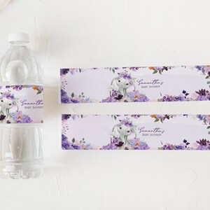 May include: Purple and white floral baby shower water bottle labels with a cute elephant design. The labels say "Samantha's Baby Shower".