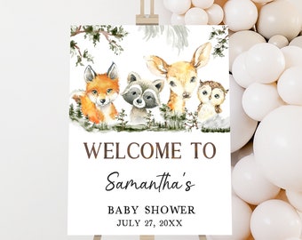 May include: Welcome to Samantha's Baby Shower sign with a watercolor illustration of a fox, raccoon, deer, and owl in a woodland setting. The sign is white with brown text and the date July 27, 20XX.