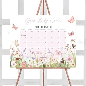a calendar on a easel with butterflies and flowers