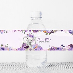 May include: Purple floral baby shower water bottle label with a cute elephant wearing a flower crown. The label says "Samantha's Baby Shower".