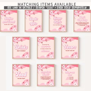 May include: Pink and white printable signs with a retro 70s font style for a baby shower. The signs include titles like "Babies are Sweet", "Books & Gifts", "Diaper Raffle", "Don't Say Baby", "Drinks", "Help the Mom-to-be", "Favors", "Food", "Late Night Diapers", and "Mom-osa Bar".
