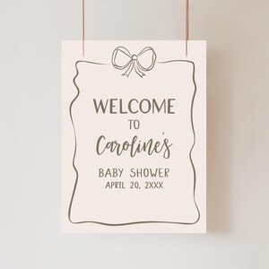 a welcome sign hanging on a wall