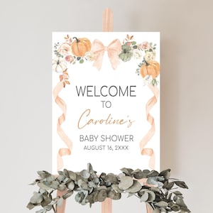 a welcome sign is displayed on a easel