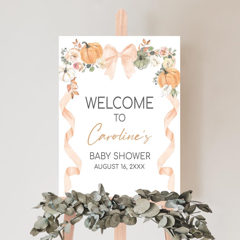 a welcome sign is displayed on a easel