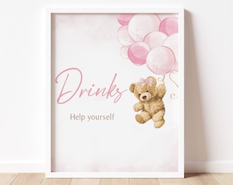 May include: A white framed sign with a pink background and the text "Drinks Help yourself". A brown teddy bear is holding pink balloons.