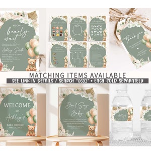 May include: A set of printable baby shower decorations with a green, brown, and beige color scheme. The decorations feature a teddy bear, balloons, and the text "We can bearly wait" and "Ashley's Baby Shower".