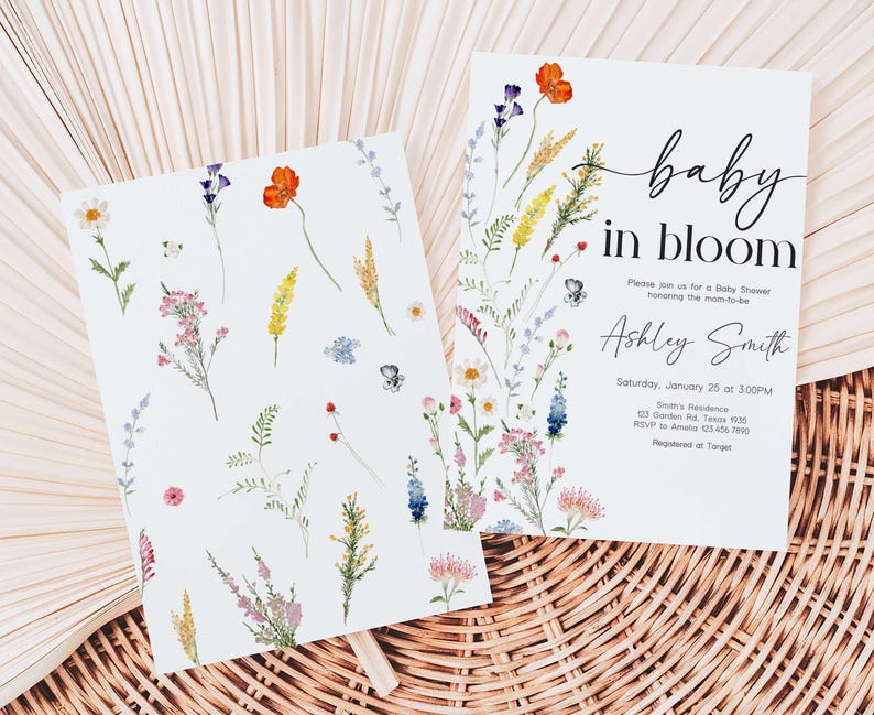 two baby in bloom cards sitting on top of a wicker basket