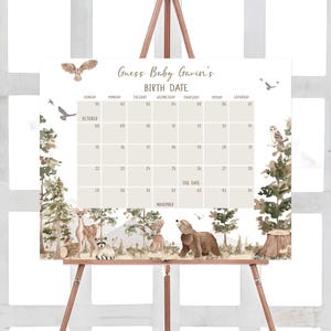 a wooden easer with a baby shower calendar on it