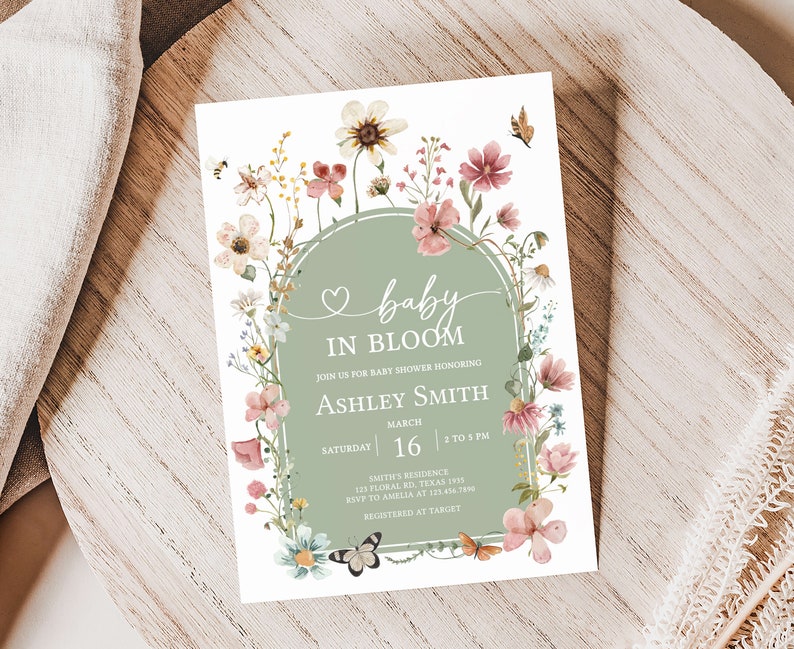 a baby is in bloom card on a table