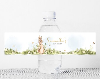 May include: Water bottle label featuring a watercolour illustration of a rabbit in a field of flowers. The label reads "Samantha's Baby Shower".