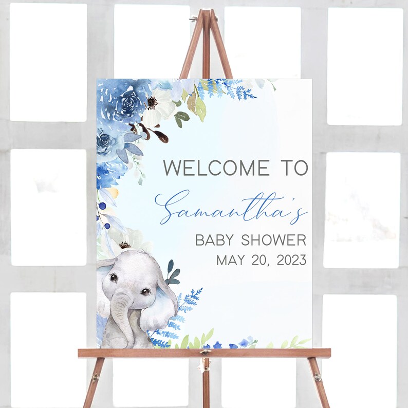 May include: Blue and white floral welcome sign with a cute grey elephant illustration. The sign says "Welcome to Samantha's Baby Shower May 20, 2023".