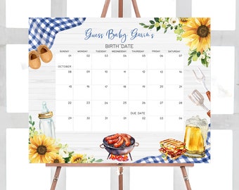 Op de afbeelding: Een wit houten bord met een blauw-wit geruit patroon aan de onderkant. Het bord heeft een kalender met de maand oktober en de dagen van de week. Het bord heeft ook de tekst "Guess Baby Gavin's Birth Date" en een uitgerekende datum van 2 november. Het bord is versierd met zonnebloemen, een babyfles, een grill met worstjes, een bierglas en een gegrilde kaassandwich.