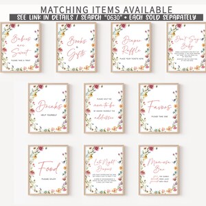 May include: Nine printable signs with floral borders and pink text for a baby shower. The signs include "Babies are Sweet", "Books & Gifts", "Diaper Raffle", "Don't Say Baby", "Drinks", "Please Help the Mom-to-be Address", "Favors", "Food", "Late Night Drapes", and "Mimosa Bar".