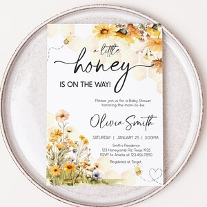 a white plate topped with a card on top of a table