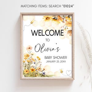 a picture of a baby shower sign hanging on a wall