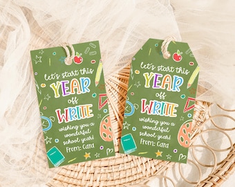 May include: Two green gift tags with the text "Let's start this YEAR off WRITE" in colorful letters. The tags have illustrations of school supplies and the message "Wishing you a wonderful school year! From: Cara."