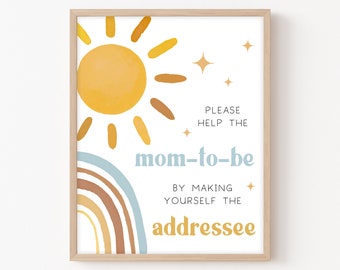 May include: A printable sign with a yellow sun and rainbow design. The text reads "PLEASE HELP THE MOM-TO-BE BY MAKING YOURSELF THE ADDRESSEE".