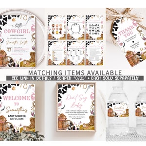 May include: A set of printable baby shower decorations with a cowgirl theme. The decorations include a welcome sign, a don't say baby sign, a thank you tag, and water bottle labels. The decorations feature a black and white cow print background with pink and gold accents.