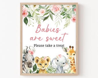 May include: A printable sign with a watercolor floral border and a pink and white text that reads "Babies are sweet. Please take a treat". The sign features a zebra, lion, elephant, and giraffe with floral crowns.