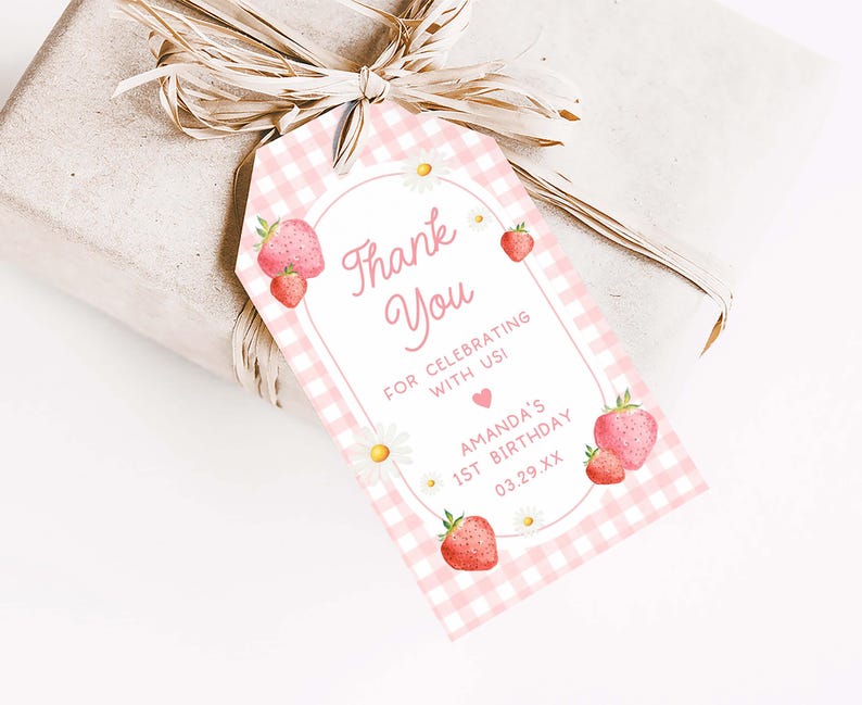 a pink and white checkered gift tag with strawberries on it