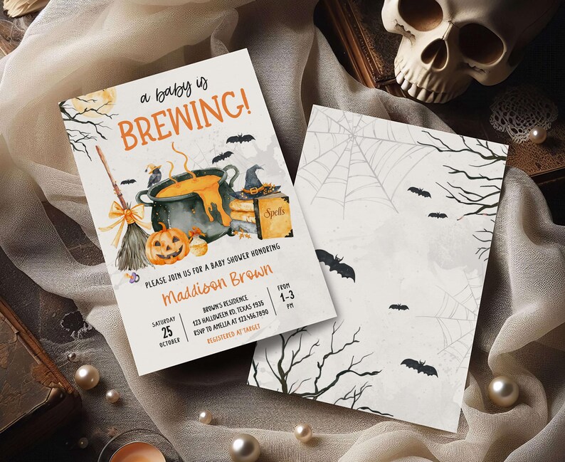 A Halloween-themed invitation for a baby shower, featuring a pot of bubbling soup, a jack-o-lantern, and bats, along with details about the event.