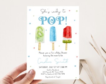 May include: A baby shower invitation with a blue, green, and red popsicle design. The text reads "She's ready to POP!" and includes the date and time of the shower, the name "Caroline Smith", and the location and RSVP information.