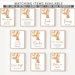 May include: Nine printable signs for a baby shower with a teddy bear theme. Each sign features a teddy bear holding balloons and a different message. The signs include "Mama-go Bar", "Late Night Drinks", "Food", "Favors", "Please help the mom-to-be by making yourself at home", "Drinks", "Don't Say Baby", "Diaper Raffle", "Books & Gifts", and "Babies are Sweet".