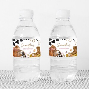 two bottles of water sitting on a table