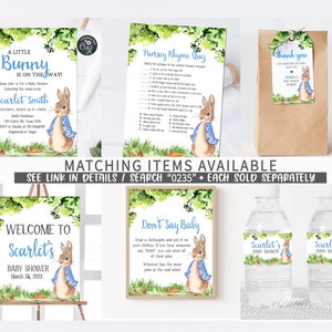 May include: A set of printable baby shower party decorations featuring a watercolor illustration of a bunny rabbit wearing a blue jacket. The set includes a welcome sign, a nursery rhyme quiz, a thank you tag, and water bottle labels. The text on the welcome sign reads "Welcome to Scarlet's Baby Shower March 26, 2023".