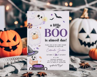 May include: A Halloween-themed baby shower invitation with the text "a little BOO is almost due!" featuring illustrations of ghosts, bats, and pumpkins. The invitation includes the date, time, and location of the shower.