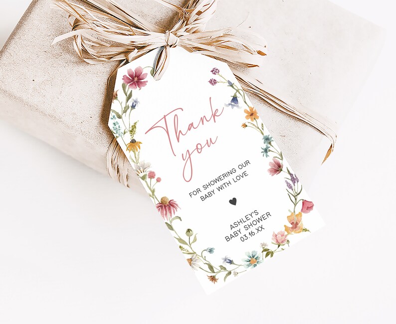 a gift wrapped in brown paper with a tag on it