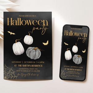 a black and white halloween party ticket next to a phone