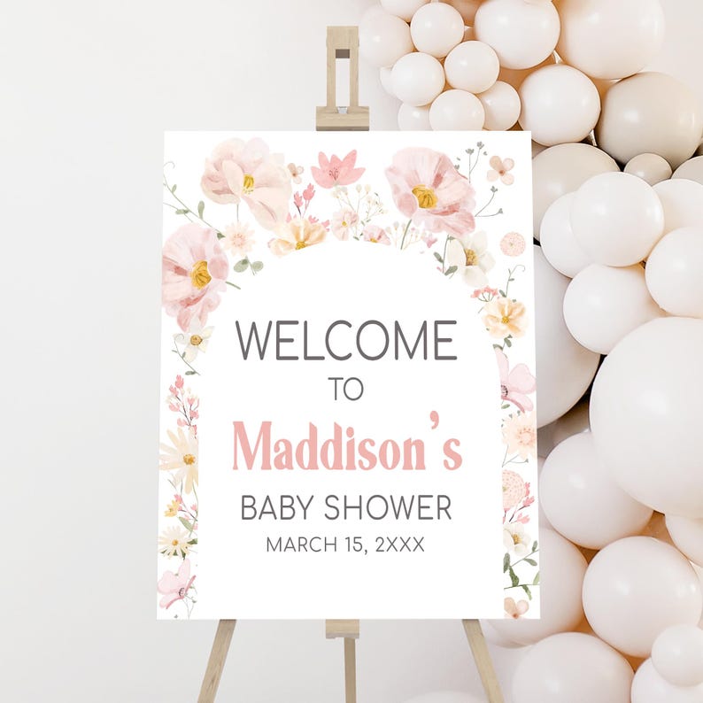 a baby shower sign surrounded by balloons