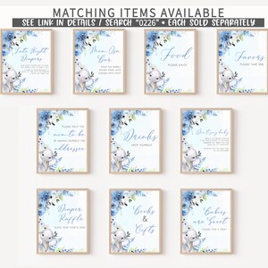 May include: Ten printable signs for a baby shower with a blue and white elephant theme. The signs include "Late Night Diapers", "Mom-osa Bar", "Food", "Favours", "Please Help the Mom-to-be Address", "Drinks", "Don't Say Baby", "Diaper Raffle", "Books & Gifts", and "Babies are Sweet".