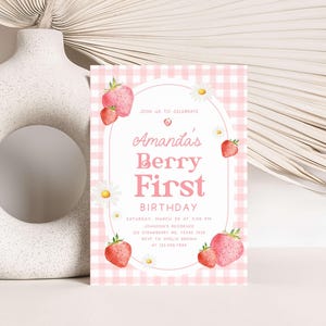 a pink and white birthday card with strawberries on it