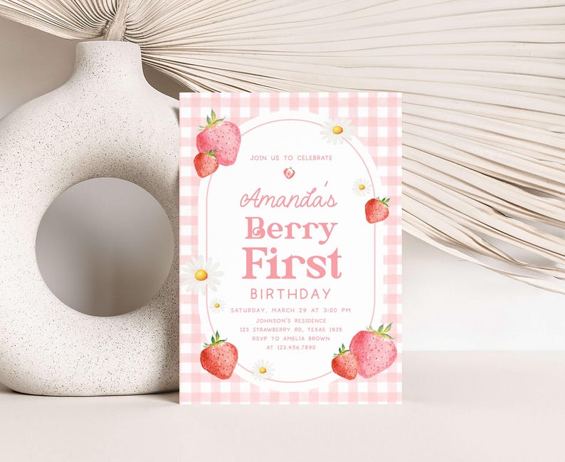 a pink and white birthday card with strawberries on it