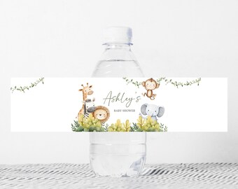 May include: Water bottle label with a jungle theme. The label features a giraffe, zebra, lion, monkey, and elephant. The text on the label reads "Ashley's Baby Shower".