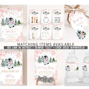 May include: A collection of baby shower stationery featuring a penguin in a winter scene. Items include invitations, games, welcome sign, water bottle labels, and thank you tags. Pink floral and snowflake accents are used throughout the designs.