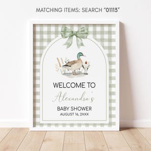 a welcome sign for a baby shower with a duck