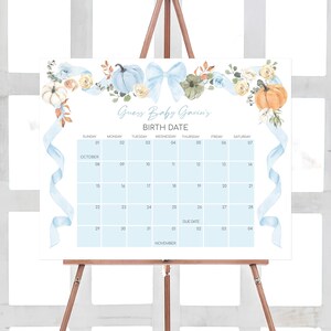 a calendar on a easel with a blue ribbon