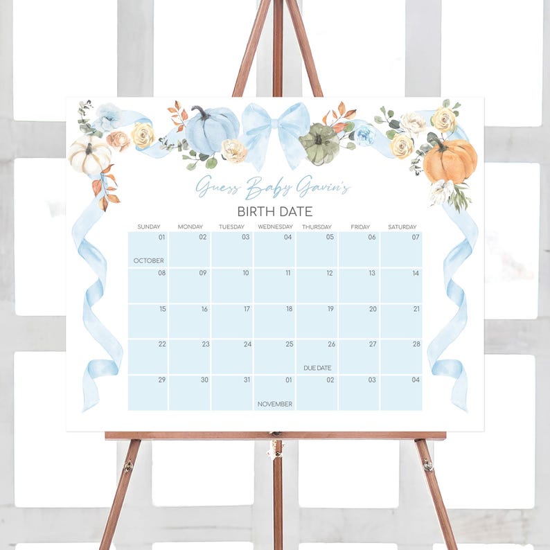a calendar on a easel with a blue ribbon