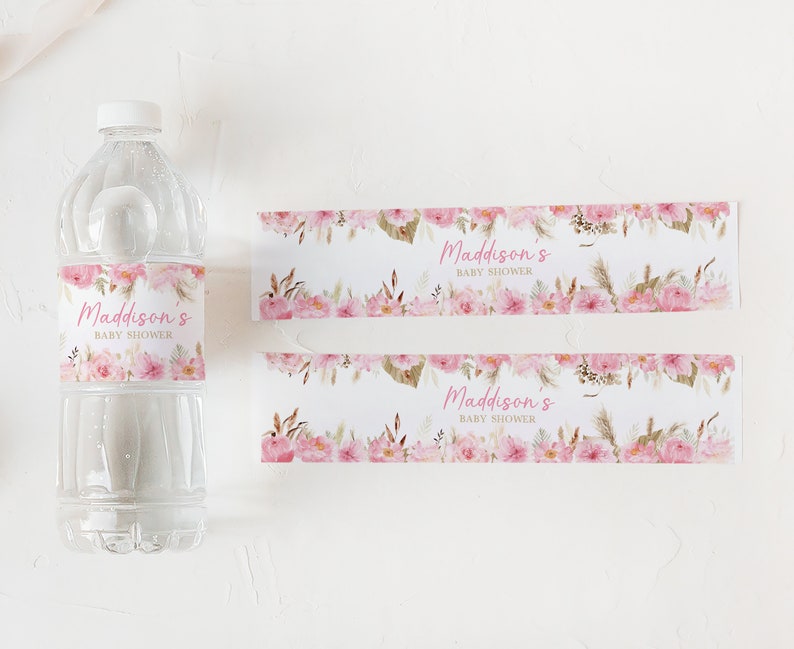 May include: Two pink and white floral water bottle labels with the text "Maddison's Baby Shower" in pink script.