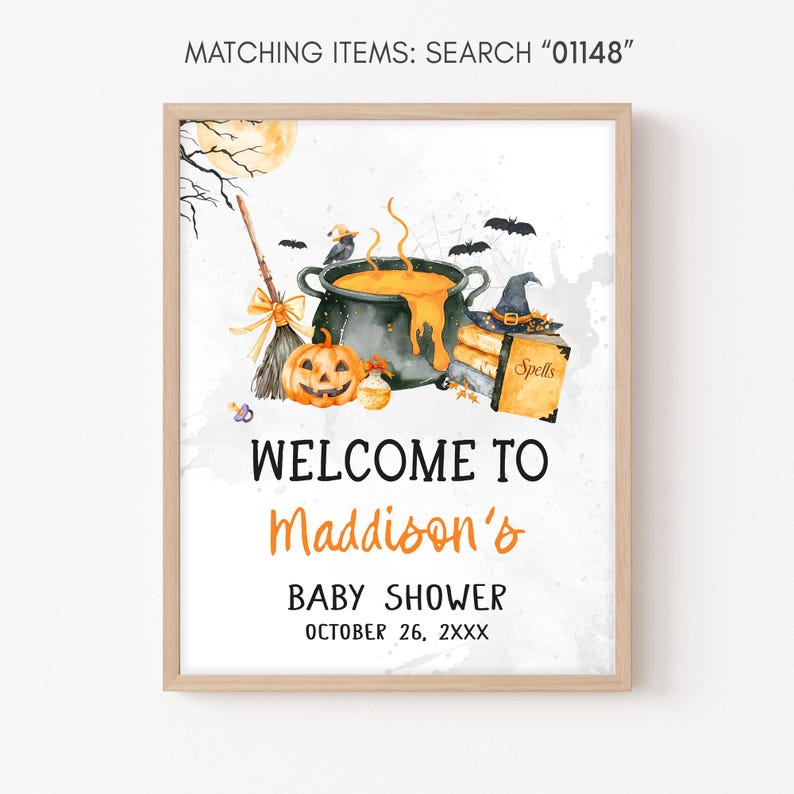 The image is a framed poster with a Halloween-themed illustration, including a pot, broom, jack-o-lantern, and bats. The poster welcomes visitors to Maddison's baby shower and provides the date and time as October 26, 2XX.