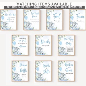 a set of nine blue and white baby shower items