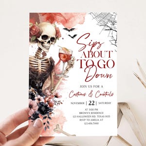 The image is a Halloween-themed invitation featuring a skeleton holding a drink and surrounded by flowers and a spider web.