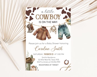 May include: A baby shower invitation with a cowboy theme. The invitation features a line of clothes hanging on a clothesline, including a brown leather jacket, a pair of blue jeans, a bandana, and a pair of cowboy boots. The text on the invitation reads "a little cowboy is on the way!" and includes the date, time, and location of the shower. The invitation also includes the text "Registered at Target".