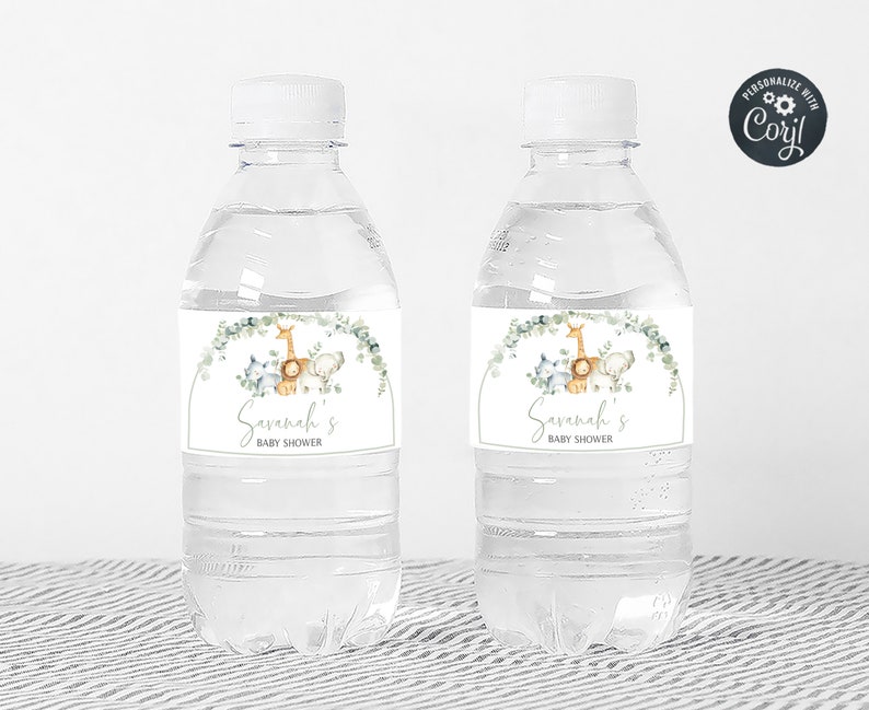 May include: Two clear plastic water bottles with personalized labels for a baby shower. The labels feature a watercolor illustration of a giraffe, a lion, and a zebra with greenery and the text "Savannah's Baby Shower".