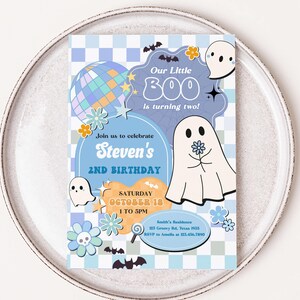 a white plate with a blue and white birthday card on it